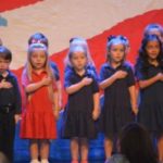 Children singing to honor veterans